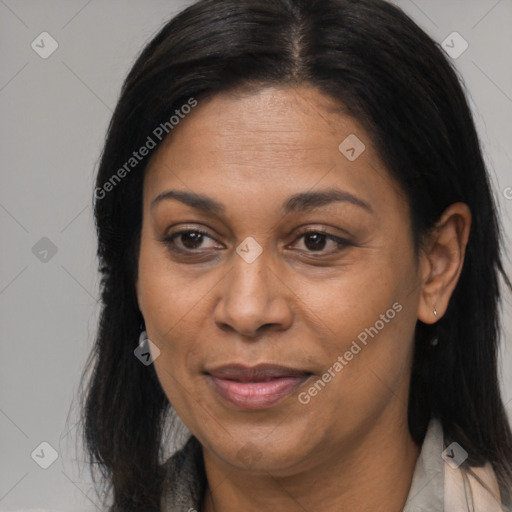 Joyful latino adult female with long  brown hair and brown eyes