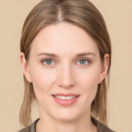 Joyful white young-adult female with medium  brown hair and grey eyes