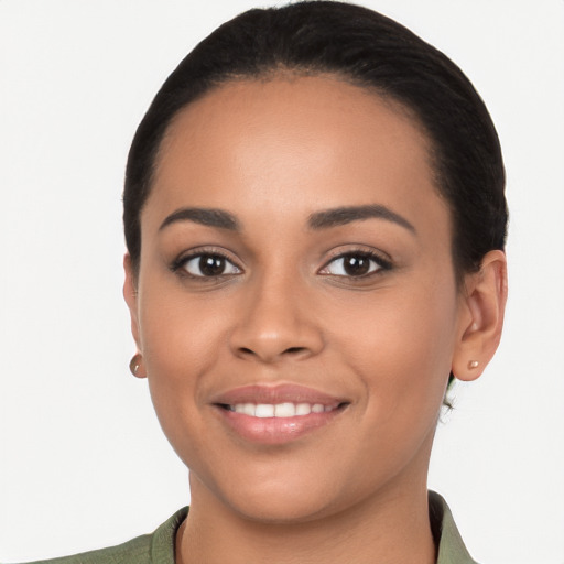 Joyful latino young-adult female with short  brown hair and brown eyes