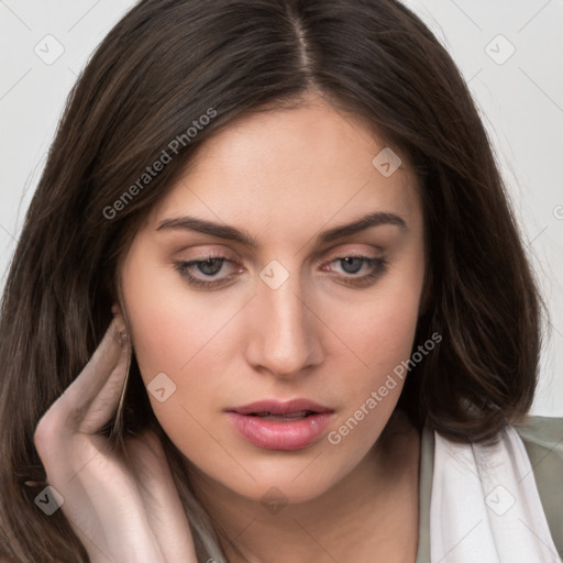 Neutral white young-adult female with long  brown hair and brown eyes