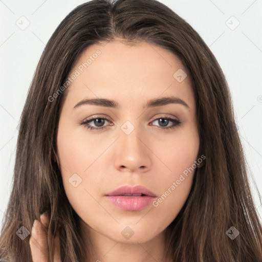 Neutral white young-adult female with long  brown hair and brown eyes