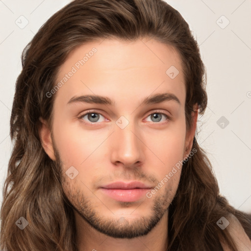 Neutral white young-adult male with long  brown hair and brown eyes