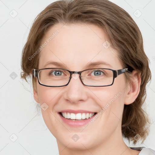 Joyful white young-adult female with medium  brown hair and blue eyes