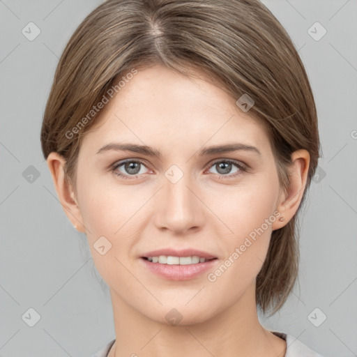 Joyful white young-adult female with medium  brown hair and grey eyes