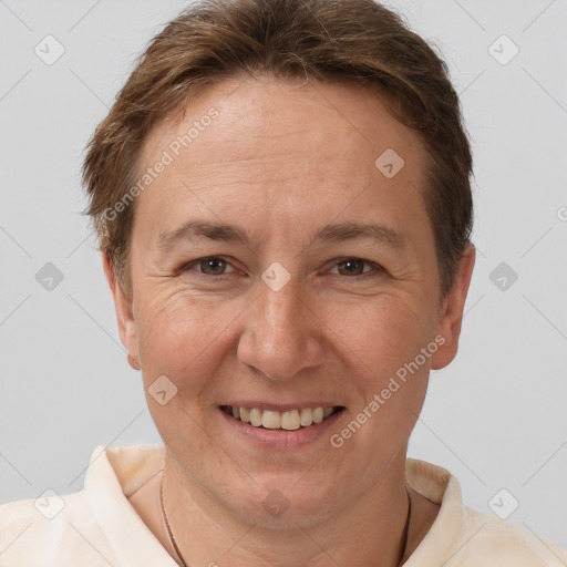 Joyful white adult female with short  brown hair and brown eyes