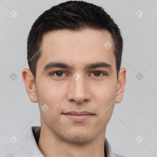 Joyful white young-adult male with short  brown hair and brown eyes