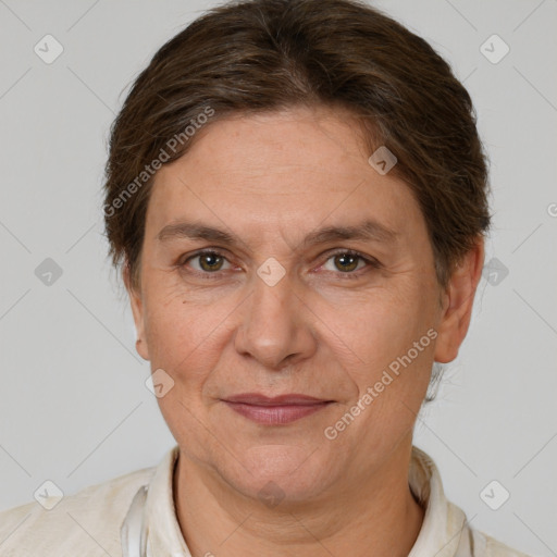 Joyful white adult female with short  brown hair and brown eyes