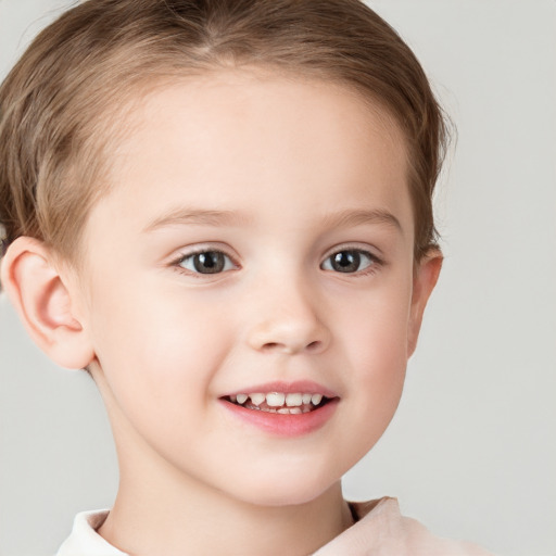 Joyful white child female with short  brown hair and brown eyes