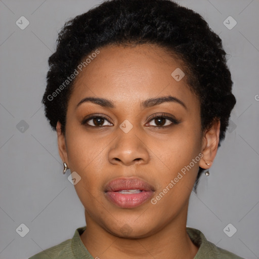 Joyful black young-adult female with short  black hair and brown eyes