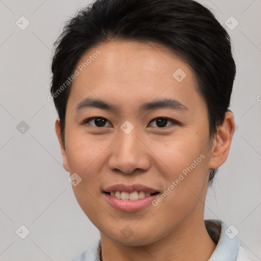 Joyful asian young-adult male with short  brown hair and brown eyes