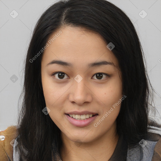 Joyful asian young-adult female with long  brown hair and brown eyes