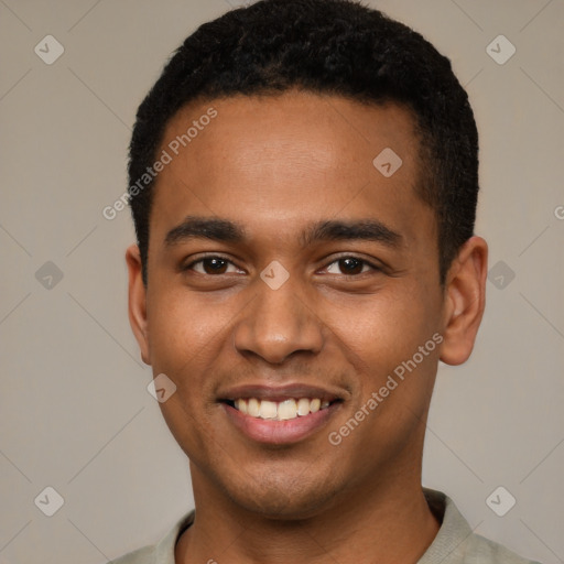 Joyful black young-adult male with short  black hair and brown eyes