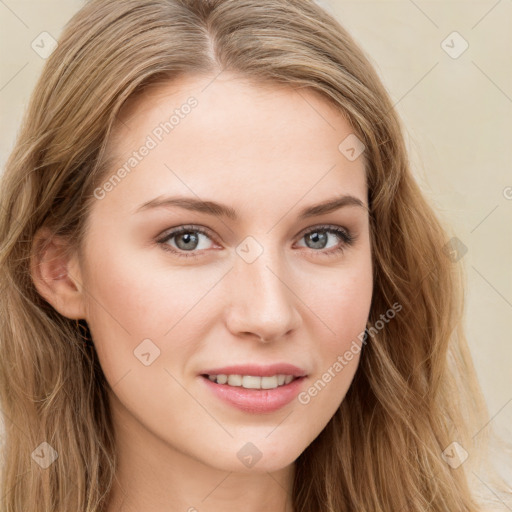 Joyful white young-adult female with long  brown hair and blue eyes