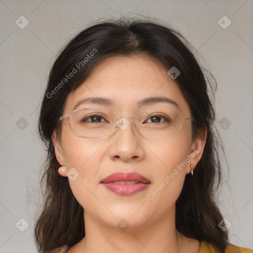 Joyful asian adult female with medium  brown hair and brown eyes
