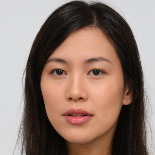 Neutral asian young-adult female with long  brown hair and brown eyes