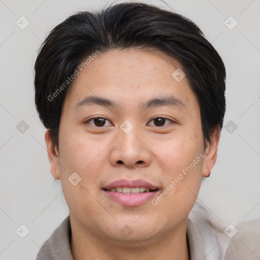 Joyful asian young-adult male with short  brown hair and brown eyes