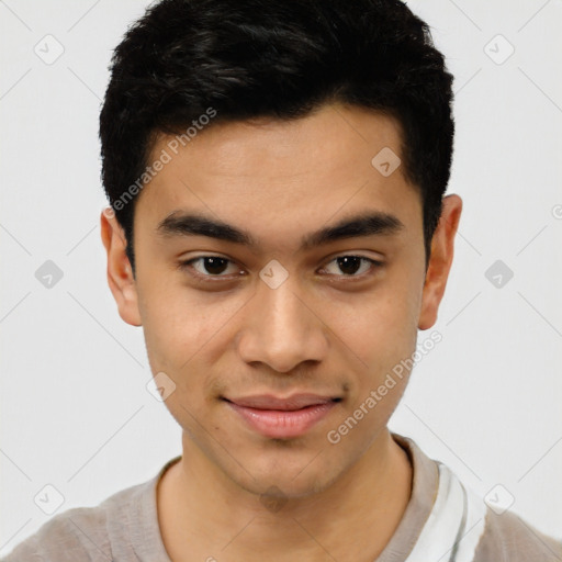 Joyful latino young-adult male with short  black hair and brown eyes