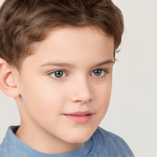 Joyful white child male with short  brown hair and brown eyes