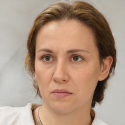 Neutral white adult female with medium  brown hair and brown eyes