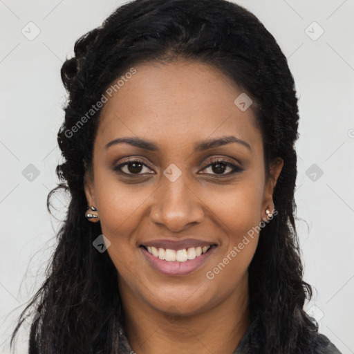 Joyful black young-adult female with long  black hair and brown eyes