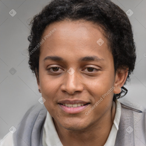 Joyful black young-adult male with short  brown hair and brown eyes