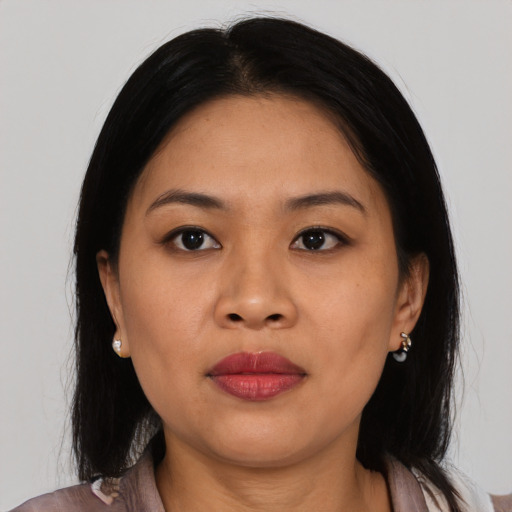 Joyful asian young-adult female with medium  black hair and brown eyes