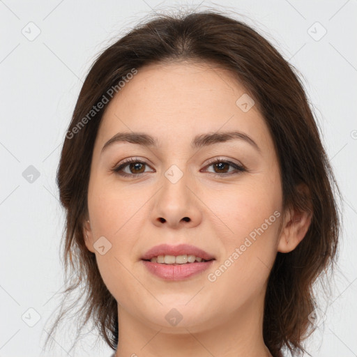 Joyful white young-adult female with medium  brown hair and brown eyes