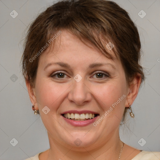 Joyful white adult female with medium  brown hair and brown eyes