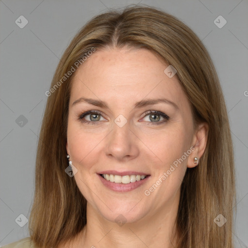 Joyful white adult female with medium  brown hair and grey eyes