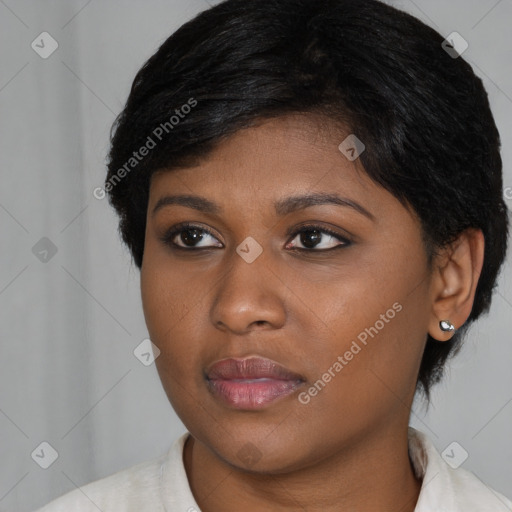 Joyful asian young-adult female with short  black hair and brown eyes