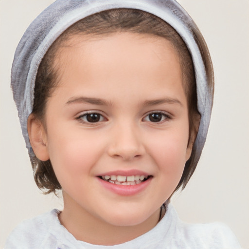 Joyful white child female with short  brown hair and brown eyes