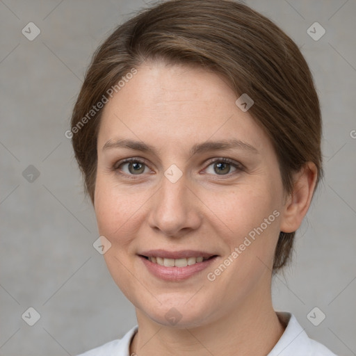 Joyful white adult female with medium  brown hair and grey eyes