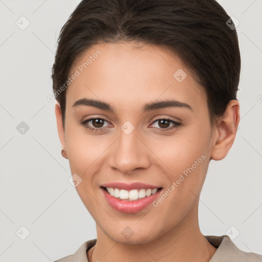 Joyful white young-adult female with short  brown hair and brown eyes