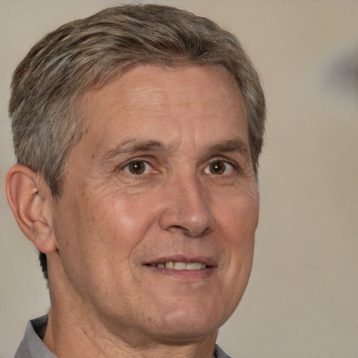 Joyful white middle-aged male with short  brown hair and brown eyes