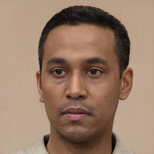 Neutral latino young-adult male with short  black hair and brown eyes