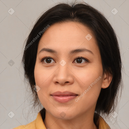 Joyful asian young-adult female with medium  brown hair and brown eyes