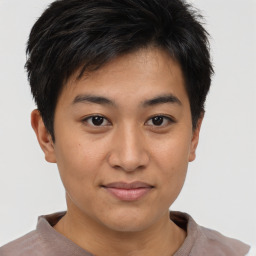 Joyful asian young-adult male with short  brown hair and brown eyes