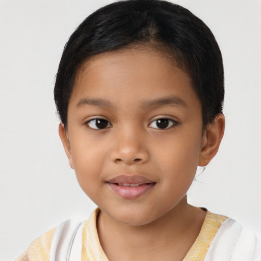 Joyful latino child female with short  brown hair and brown eyes