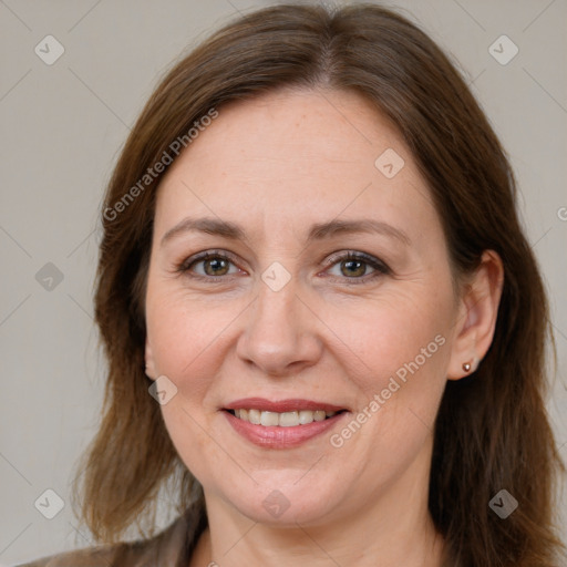 Joyful white adult female with medium  brown hair and grey eyes