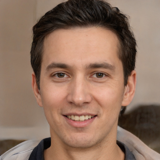 Joyful white young-adult male with short  brown hair and brown eyes