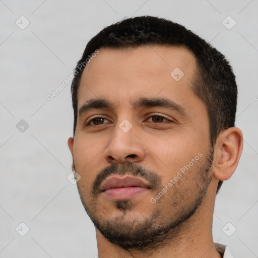 Neutral latino young-adult male with short  black hair and brown eyes