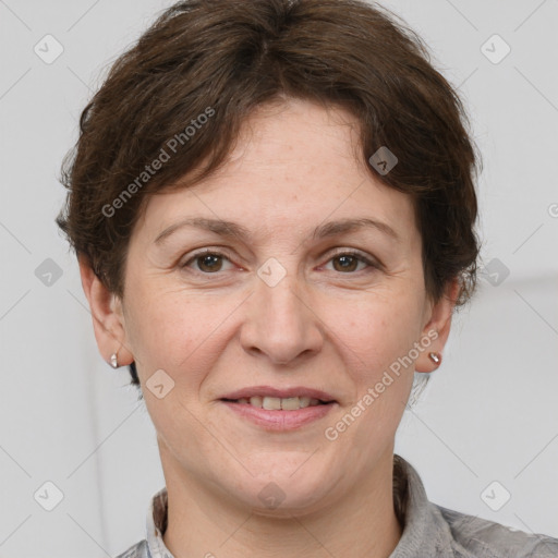 Joyful white adult female with short  brown hair and grey eyes