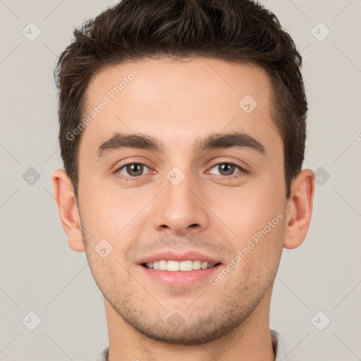 Joyful white young-adult male with short  brown hair and brown eyes