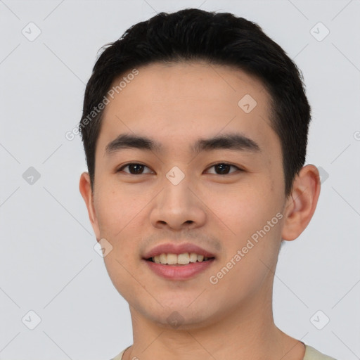 Joyful asian young-adult male with short  black hair and brown eyes