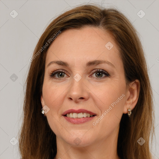 Joyful white adult female with long  brown hair and brown eyes