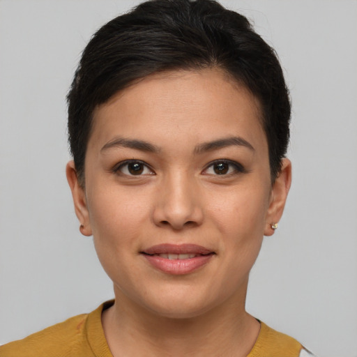 Joyful asian young-adult female with short  brown hair and brown eyes
