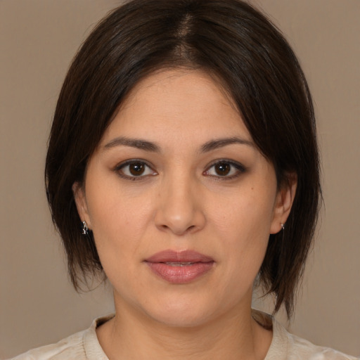 Joyful white young-adult female with medium  brown hair and brown eyes