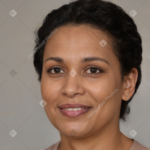 Joyful latino adult female with medium  brown hair and brown eyes