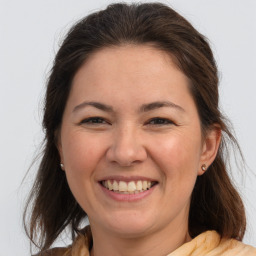 Joyful white young-adult female with medium  brown hair and brown eyes