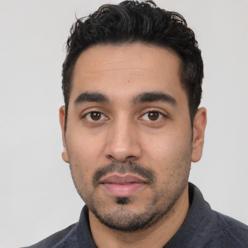 Neutral latino young-adult male with short  black hair and brown eyes